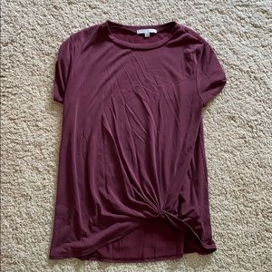 Maroon T-shirt with knot at the bottom